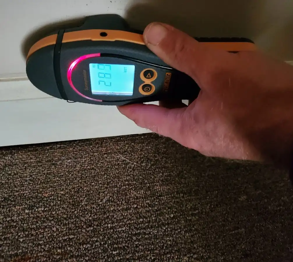 Moisture detection at baseboard during Storm Damage Restoration in Del Aire